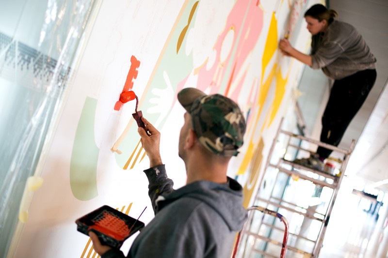 Artist during painting a wall desing for pkp  | Łódź Fabryczna-Święto flagi | Portfolio