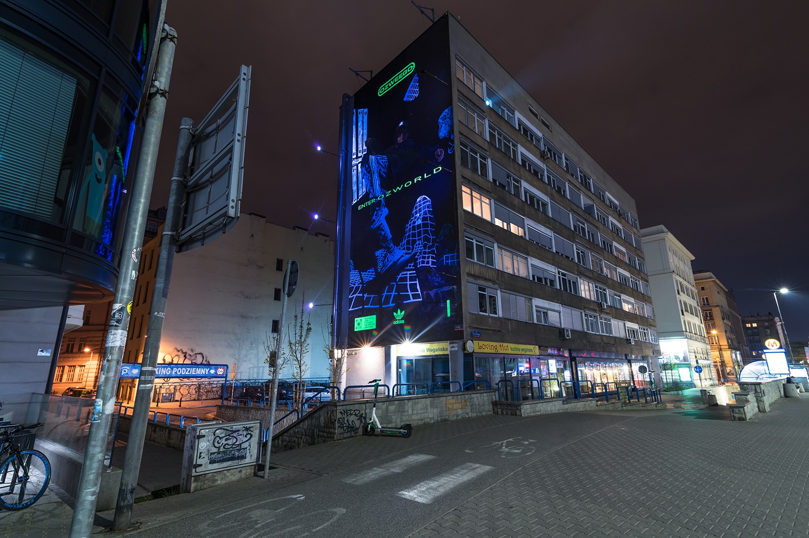 Adidas OZWORLD mural with fluo paints on Waryńskiego street in Warsaw | Enter OZWORLD | Portfolio
