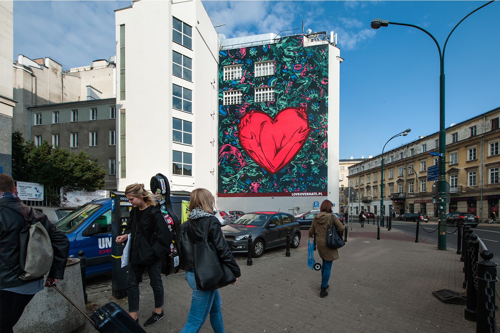 Mural LOVE OVER HATE painted by UV paint at 25 Bracka street in Warsaw | Love Over Hate | Portfolio
