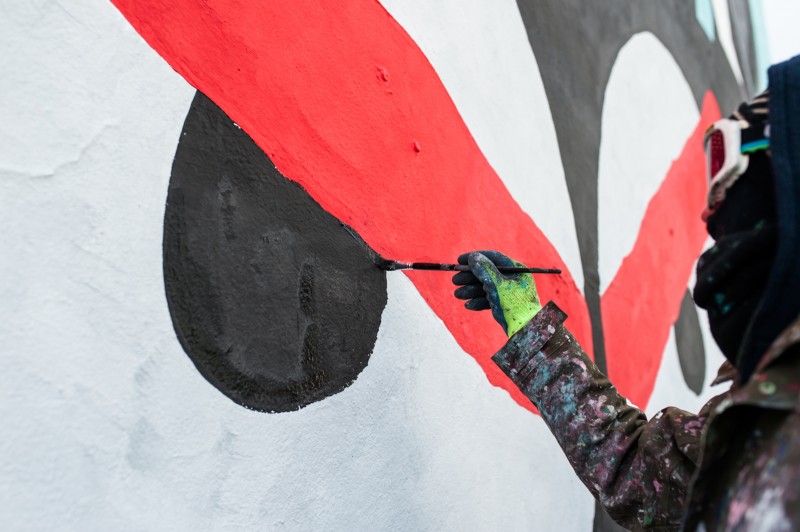 Painter painting wall graphics in Warsaw on chmielna street | YOPE | Portfolio