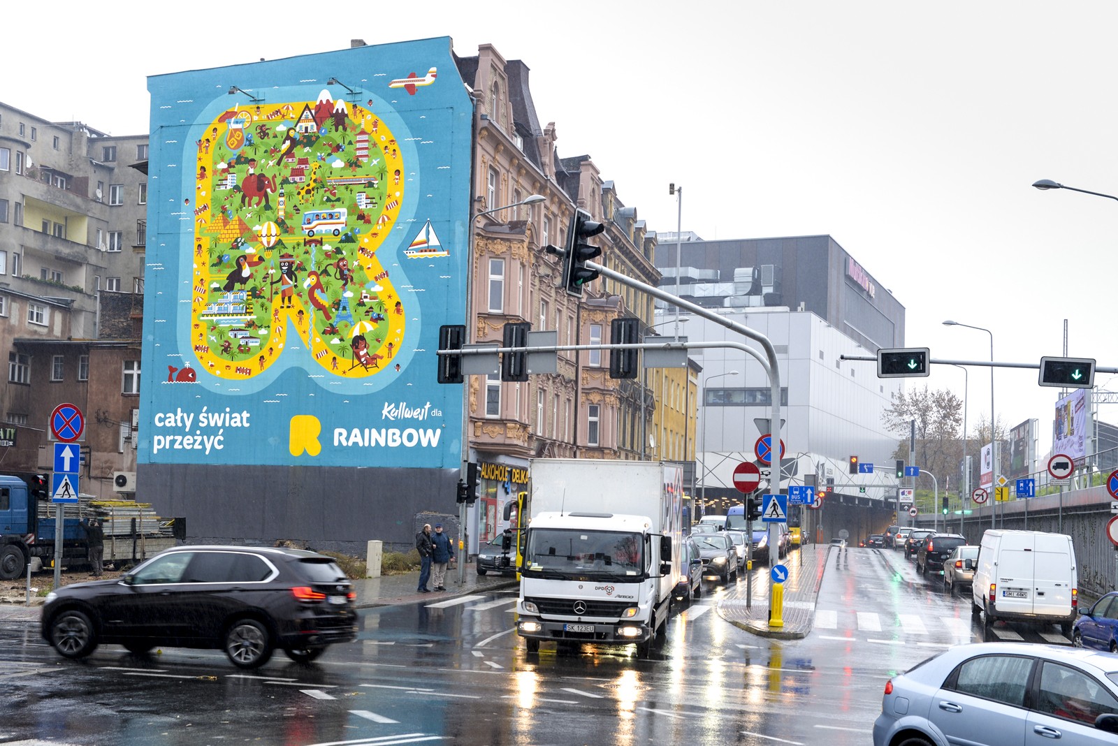 Ręcznie malowana reklama Rainbow Tours w Katowicach | Kampania dla biura podróży Rainbow | Portfolio