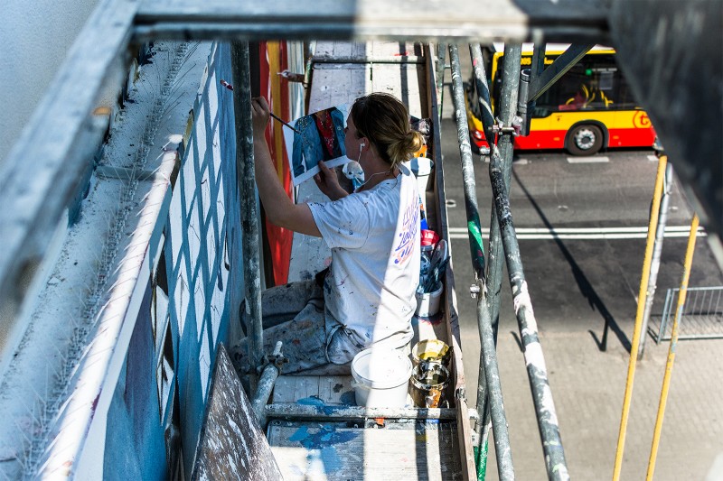 The painter paints the advertisement Tidal x Prince Dobra 53 Street Warsaw | Tidal x Prince | Portfolio